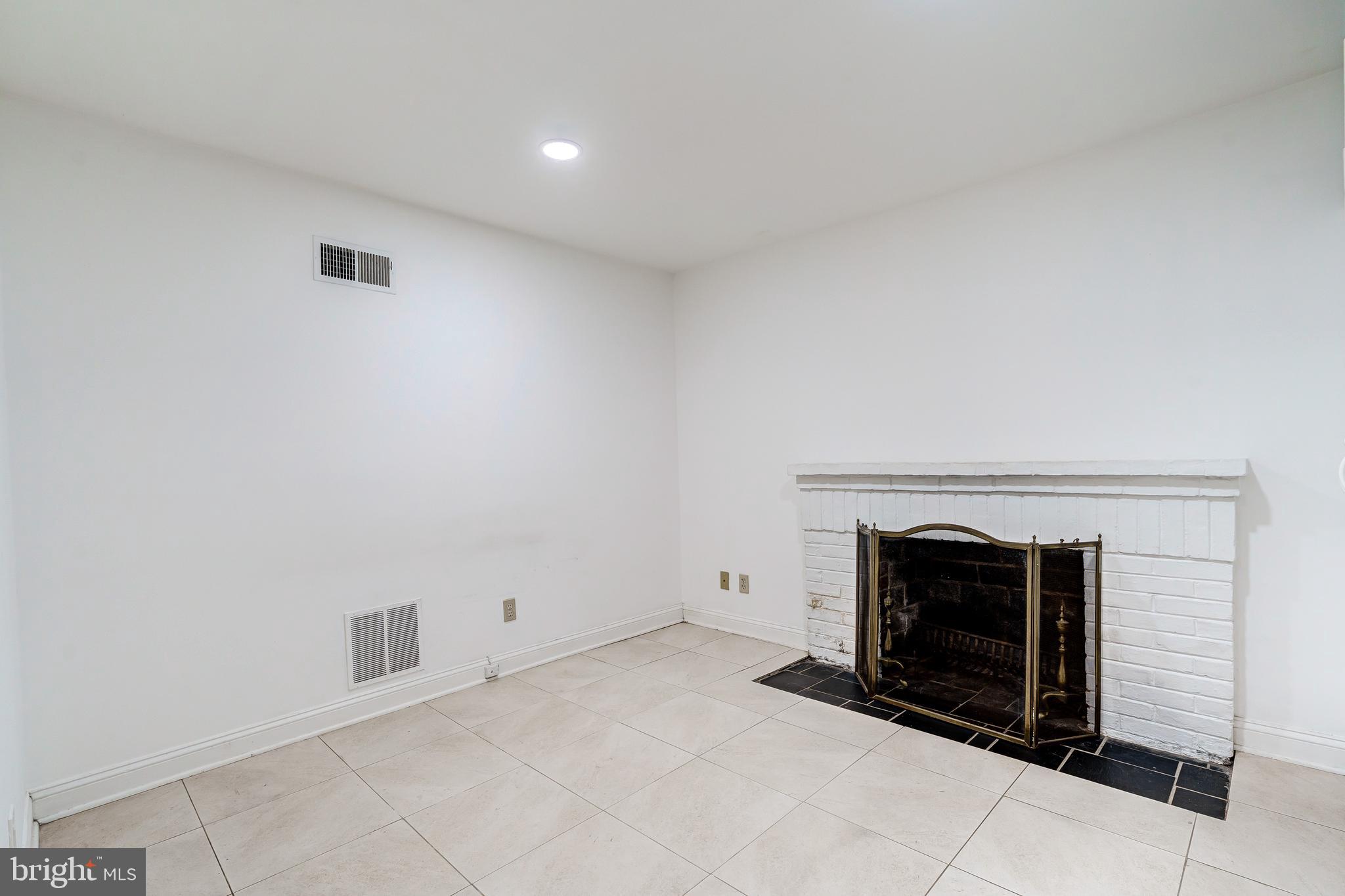4708 Reservoir Road Northwest Washington, DC 20007 - Photo 47 of 88 Lower level second fireplace