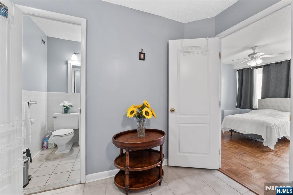 277 Prospect Avenue, Unit 11H Hackensack, NJ 07601 - Photo 14 of 23 a bathroom with a sink and a toilet