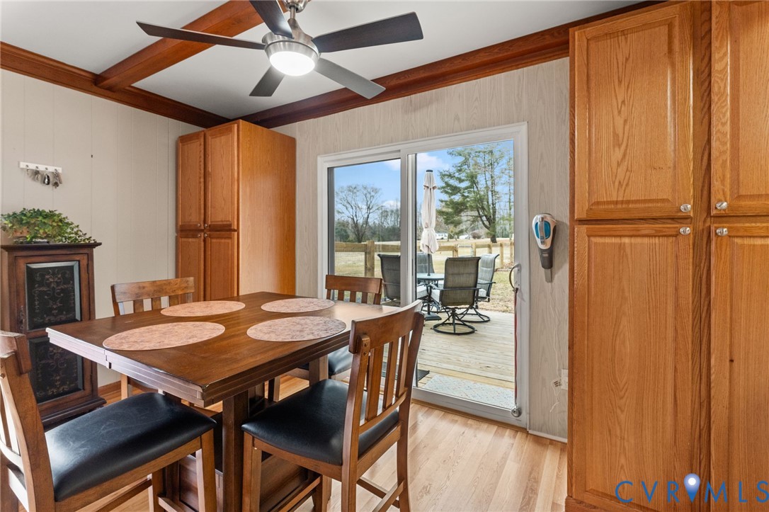 8674 Mary Ball Road Lancaster, VA 22503 - Photo 12 of 38 a dining room with furniture window and wooden floor