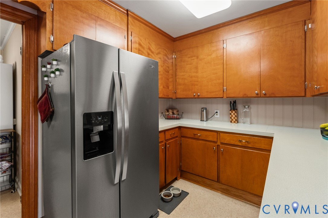 8674 Mary Ball Road Lancaster, VA 22503 - Photo 20 of 38 a kitchen with stainless steel appliances granite countertop a refrigerator and a sink