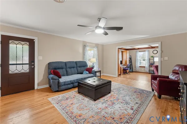 a living room with furniture and a rug