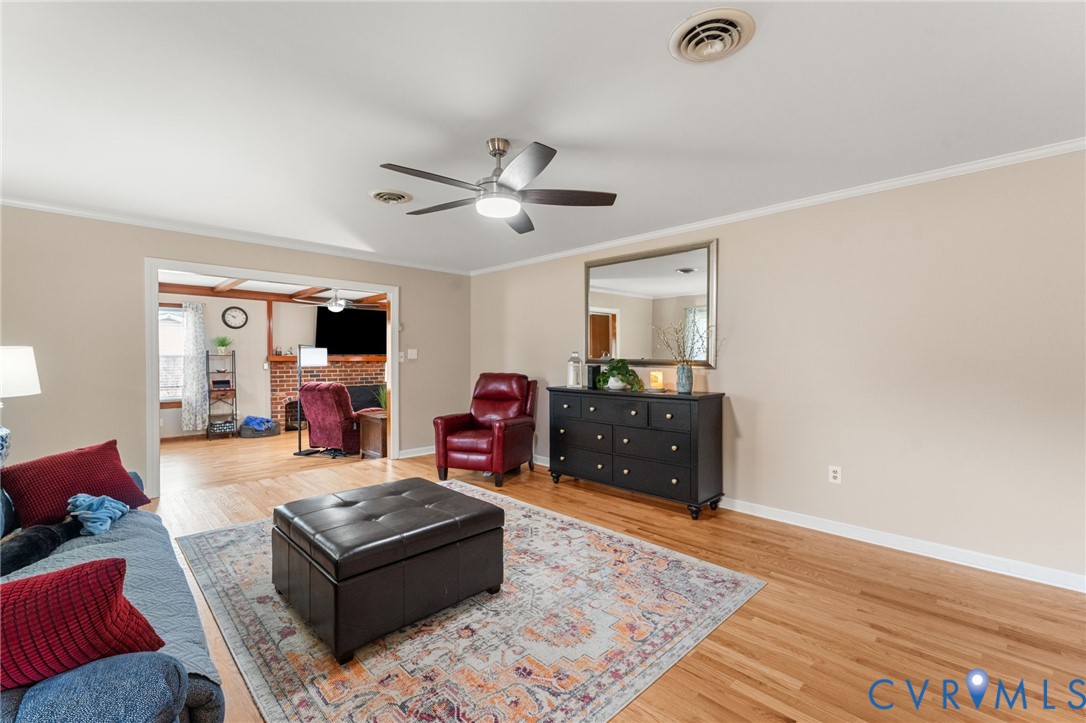 8674 Mary Ball Road Lancaster, VA 22503 - Photo 22 of 38 a living room with furniture and a wooden floor