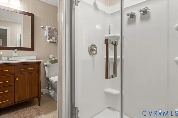 a bathroom with a granite countertop sink mirror and shower