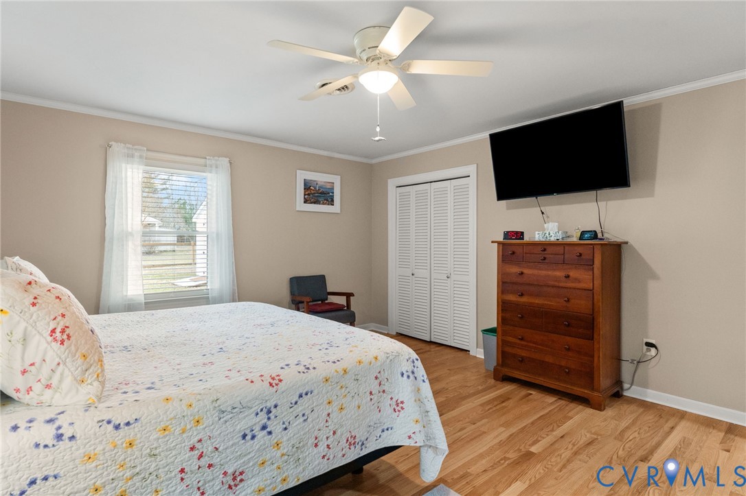8674 Mary Ball Road Lancaster, VA 22503 - Photo 28 of 38 a bedroom with a bed and a flat screen tv