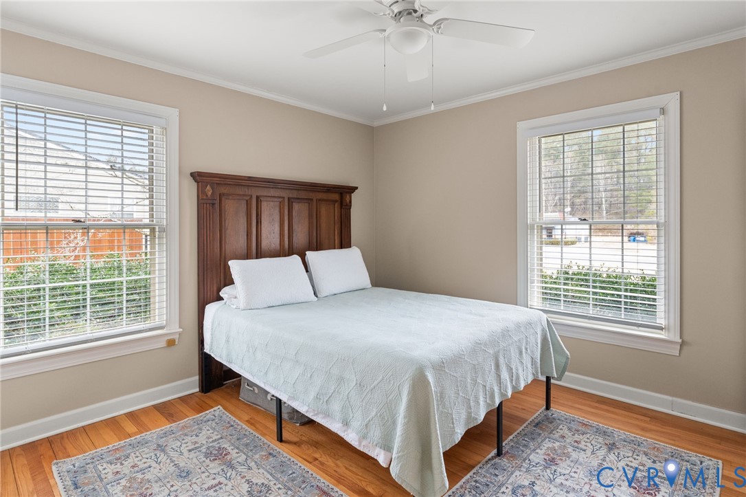 8674 Mary Ball Road Lancaster, VA 22503 - Photo 32 of 38 a bedroom with a large bed and a window