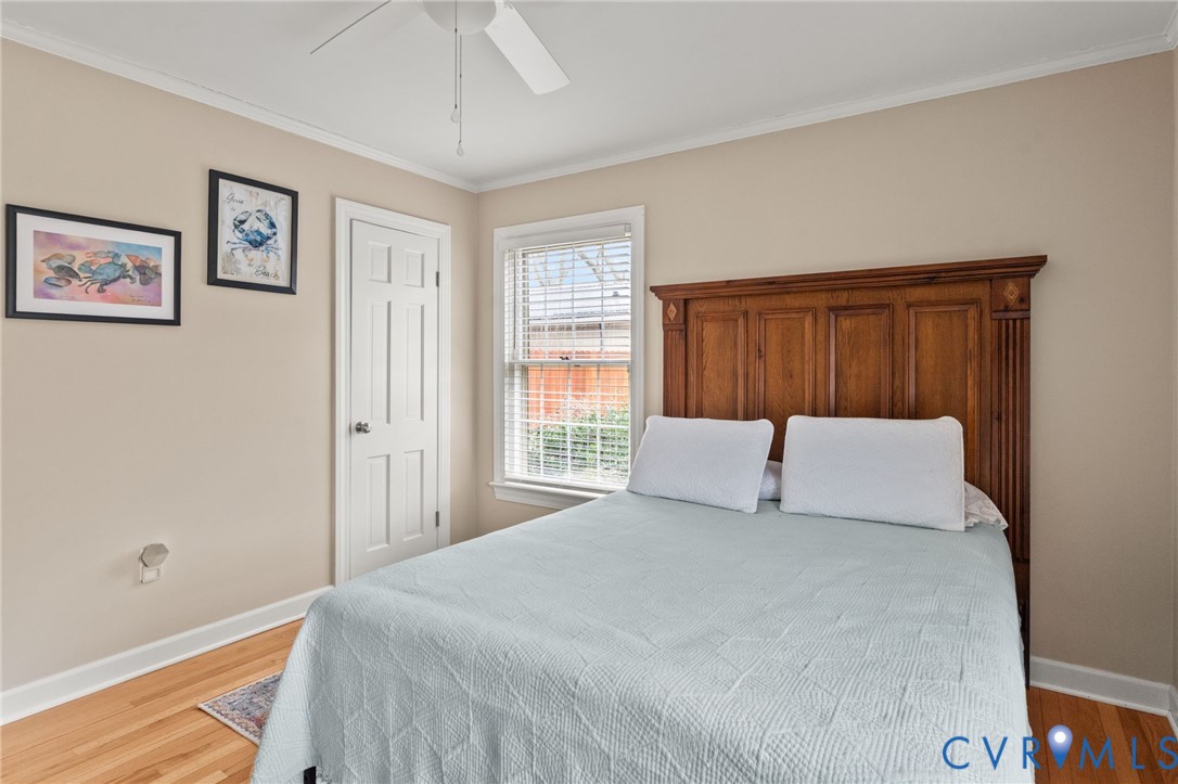 8674 Mary Ball Road Lancaster, VA 22503 - Photo 34 of 38 a bedroom with a large bed and a window