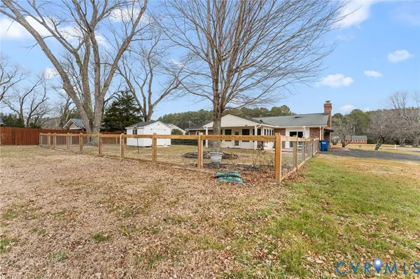 a view of house with outdoor space and sitting area