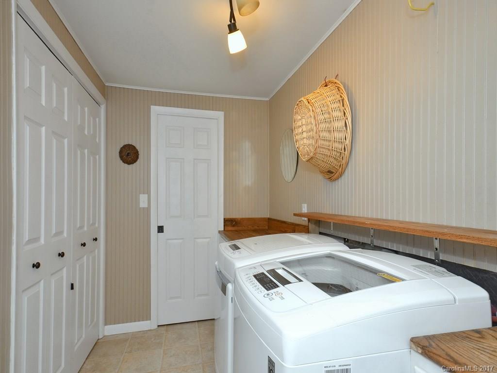 338 The High Road Waynesville, NC 28786 - Photo 13 of 19 a white stove top oven sitting inside of a kitchen