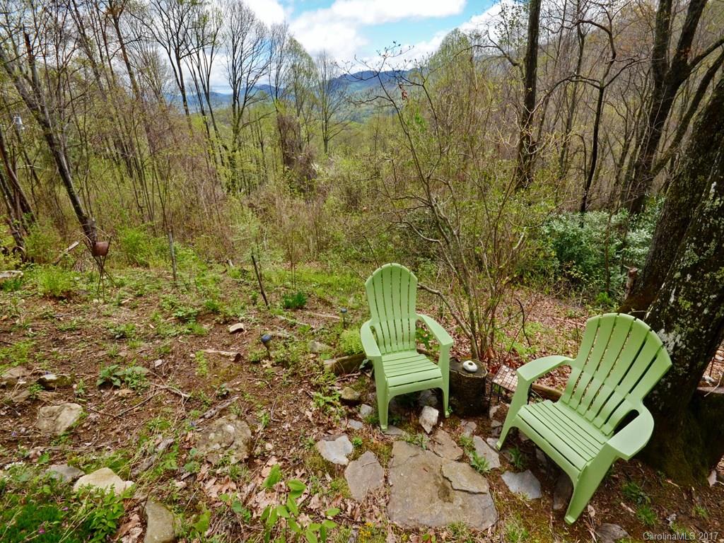 338 The High Road Waynesville, NC 28786 - Photo 18 of 19 a view of a chair and table in backyard