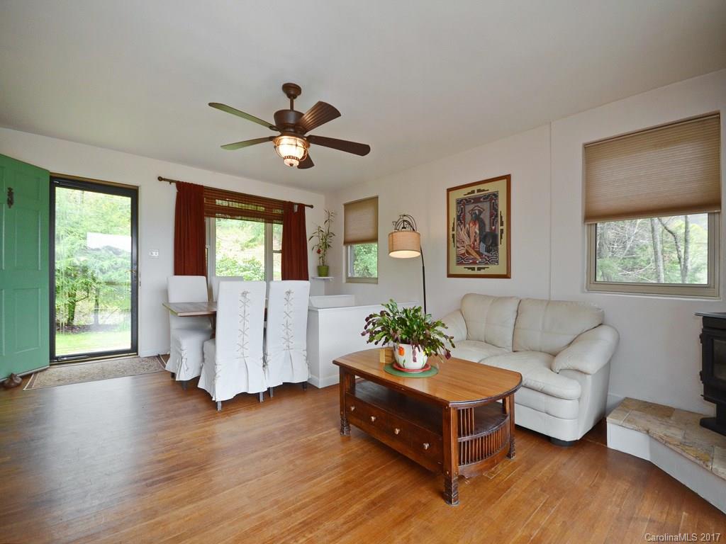 338 The High Road Waynesville, NC 28786 - Photo 9 of 19 a living room with furniture and wooden floor