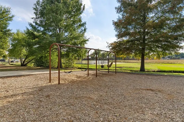 a view of a park with swings