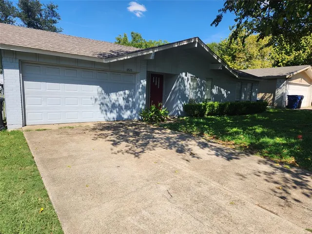 a view of a house with a small yard