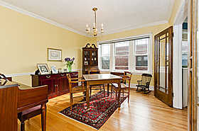 534 Sheridan Road, Unit 3A Evanston, IL 60202 - Photo 7 of 10 a living room with furniture and a chandelier