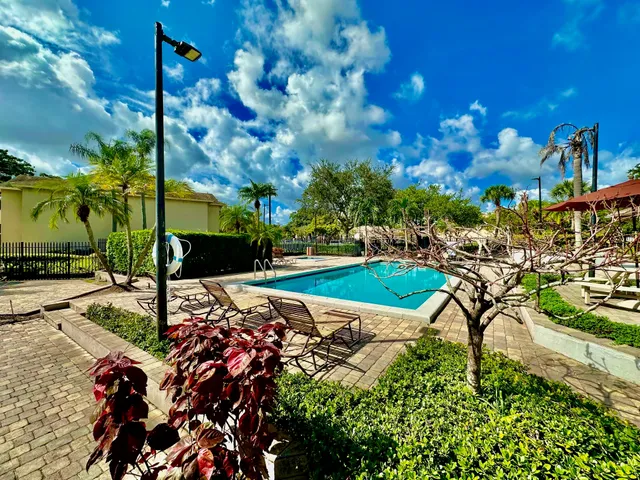 a view of a backyard with sitting area