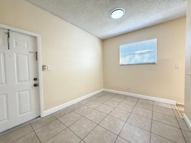 an empty room with white walls