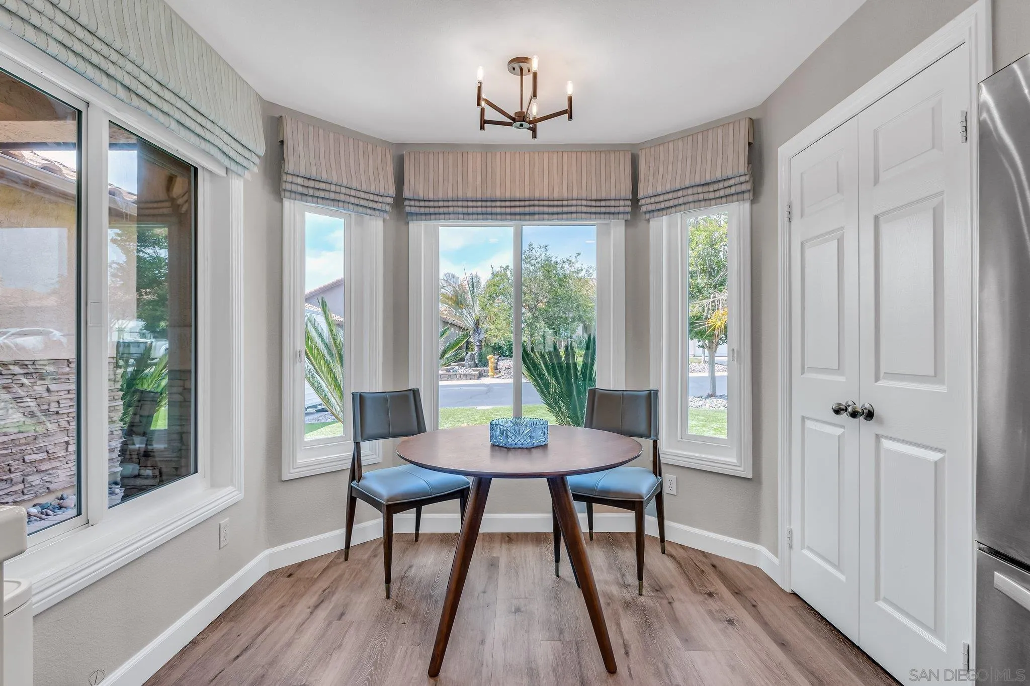 2374 Hyacinth Road Alpine, CA 91901 - Photo 17 of 28 a view of a dining room with furniture window and wooden floor