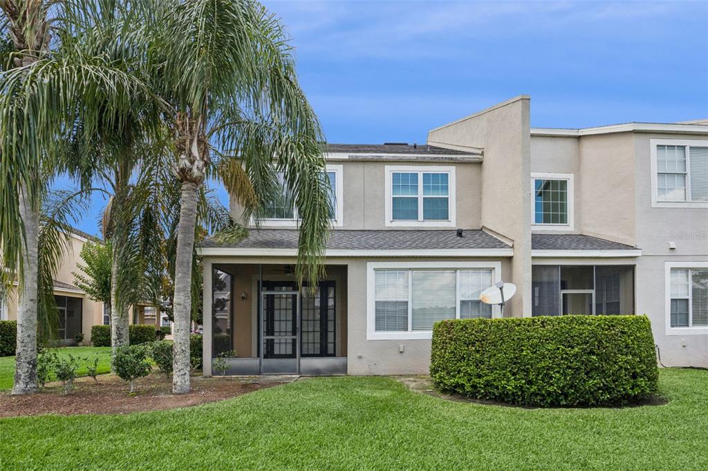 551 Terrace Spring Drive Orlando, FL 32828 - Photo 32 of 41 front view of a brick house with a yard