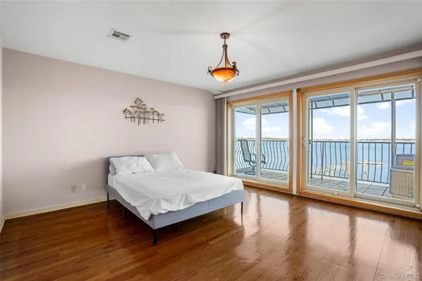 a bedroom with a bed and a table