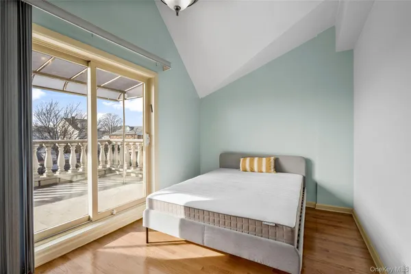 a view of a big room with wooden floor and door