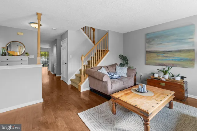 a living room with furniture fireplace and a flat screen tv