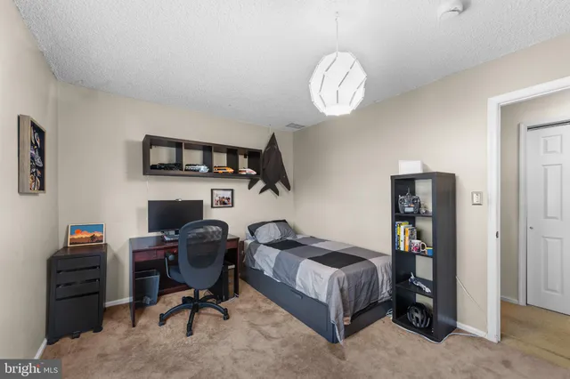 a workspace with furniture and a window