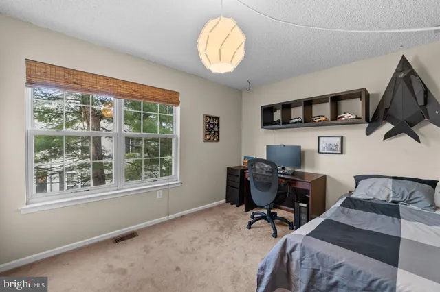 a bathroom with bathtub and window