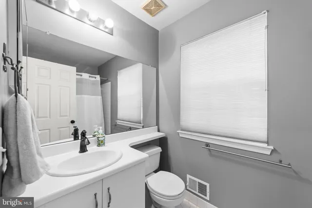 a view of swimming pool with outdoor seating and yard