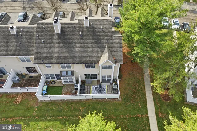 a aerial view of a house with a yard