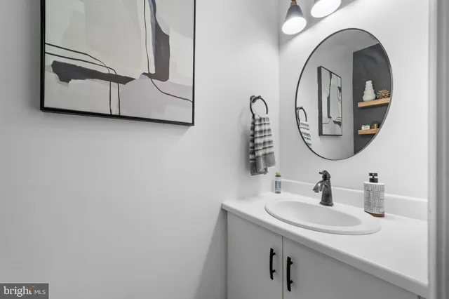 a view of a dining room with furniture wooden floor and chandelier