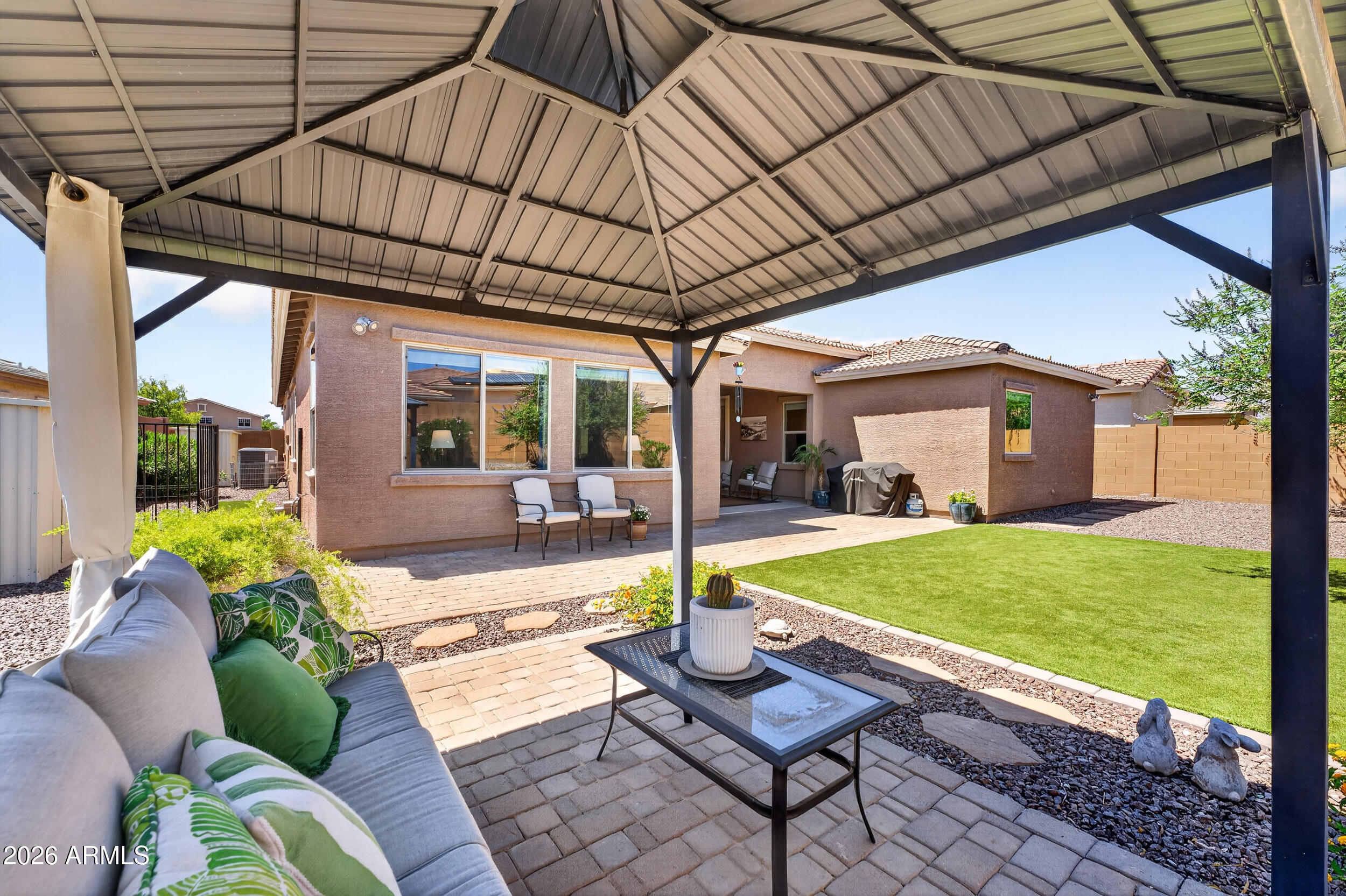 18612 West Mountain View Road Waddell, AZ 85355 - Photo 45 of 71 a backyard of a house with seating space