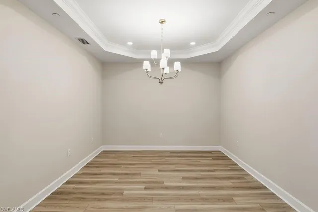 a view of a chandelier in an empty room