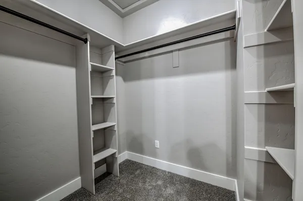 a view of an empty walk in closet