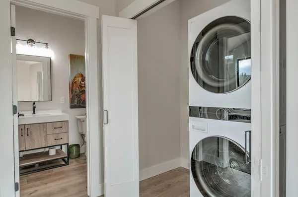 a view of a bedroom with washer and dryer