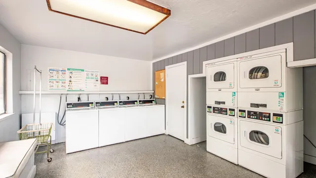 a kitchen with stainless steel appliances a white refrigerator and a stove