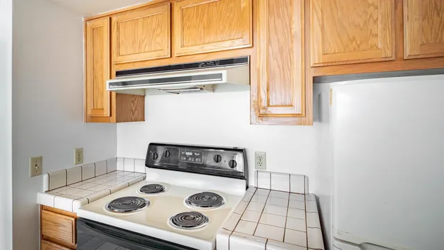 a kitchen with a stove and a microwave