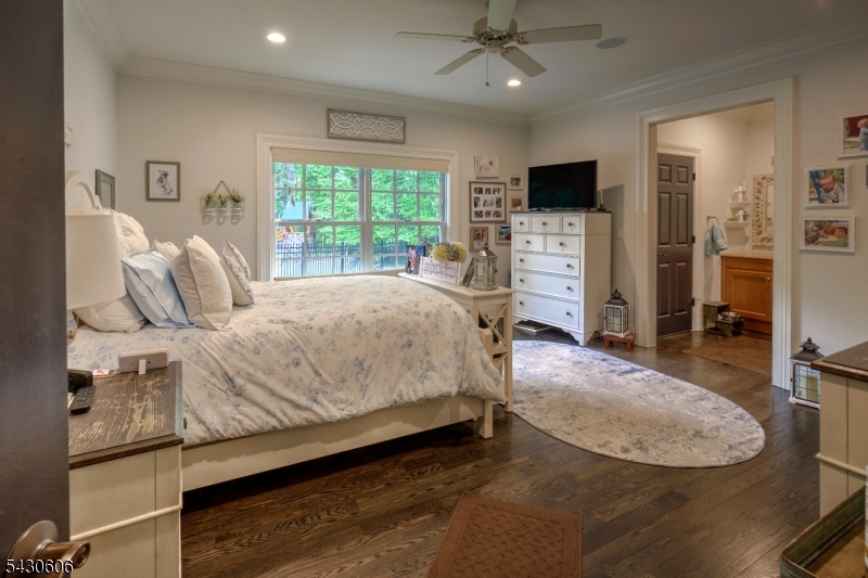 5 Burnett Road Mendham, NJ 07945 - Photo 34 of 50 a bedroom with a bed a window and a flat screen television