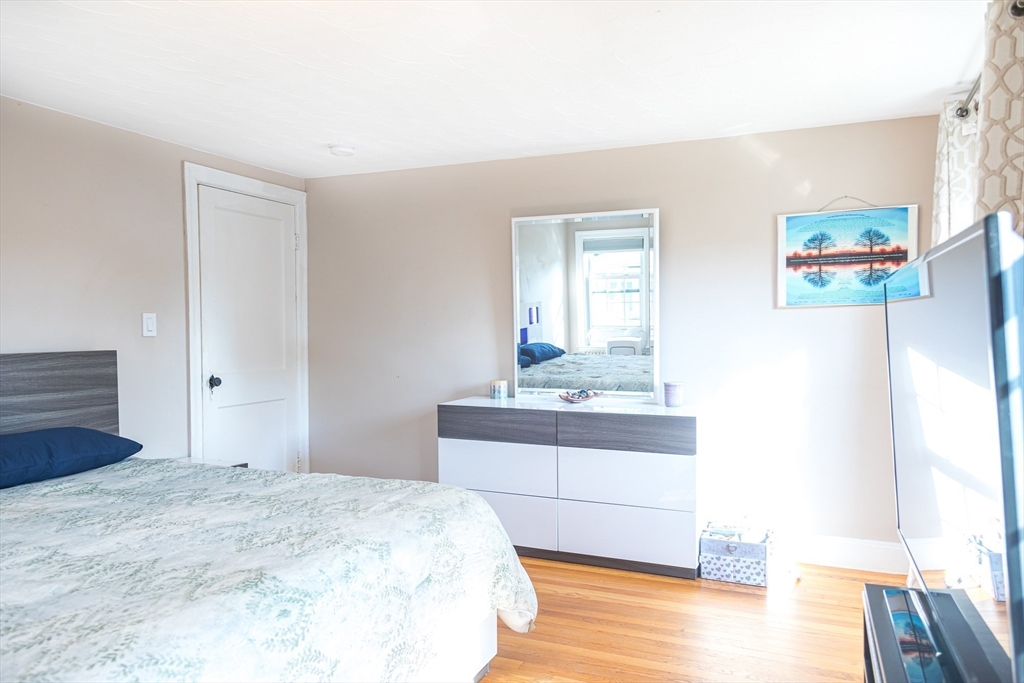 6 Ralph Road Marblehead, MA 01945 - Photo 11 of 29 a bedroom with a bed and a dresser in it