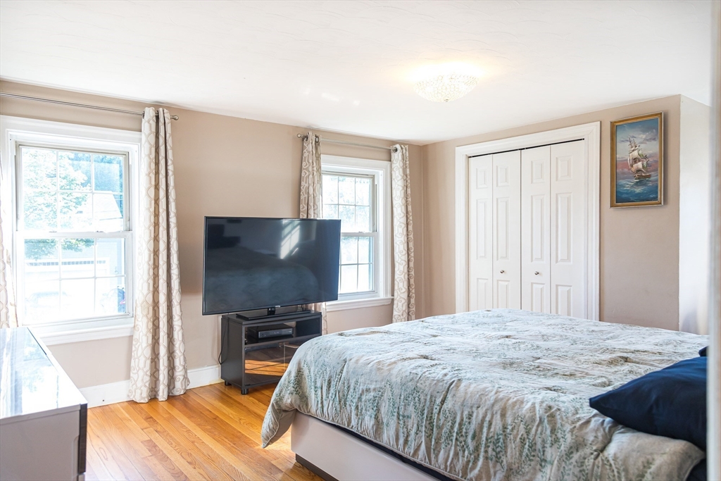 6 Ralph Road Marblehead, MA 01945 - Photo 12 of 29 a bedroom with a bed and a flat screen tv