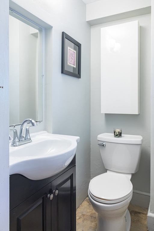 6 Ralph Road Marblehead, MA 01945 - Photo 20 of 29 a bathroom with a toilet sink and mirror