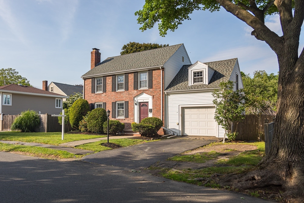 6 Ralph Road Marblehead, MA 01945 - Photo 29 of 29 a front view of a house with a yard and garage
