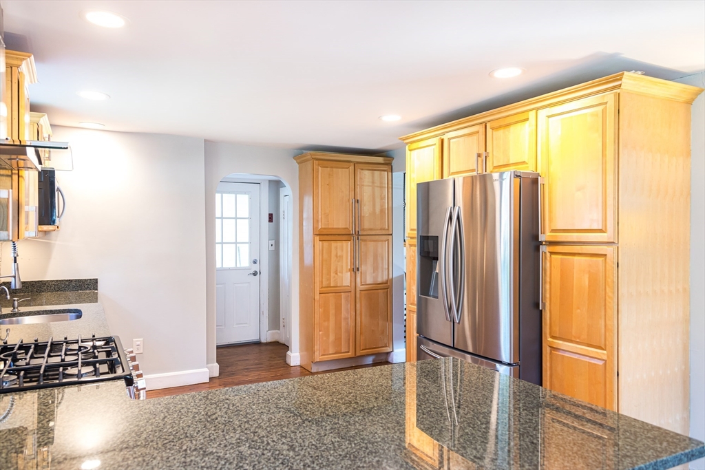 6 Ralph Road Marblehead, MA 01945 - Photo 8 of 29 a view of a kitchen with refrigerator and wooden floor