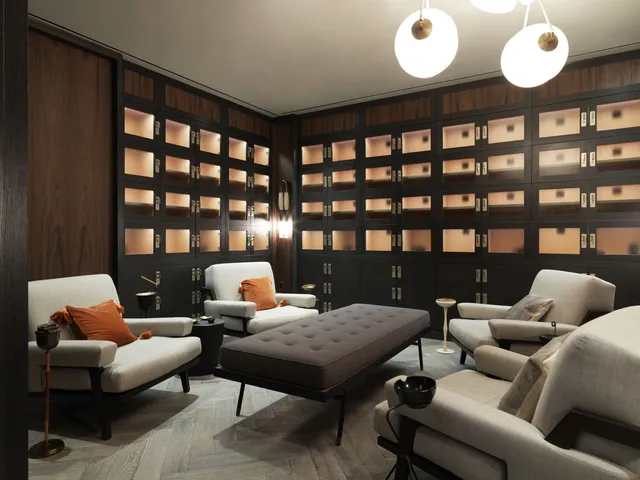 a room with stainless steel appliances granite countertop a sink a stove and a refrigerator