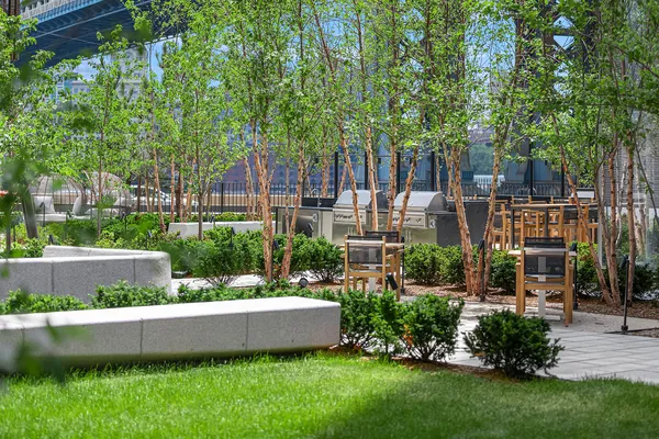 a view of a building with a yard and sitting area
