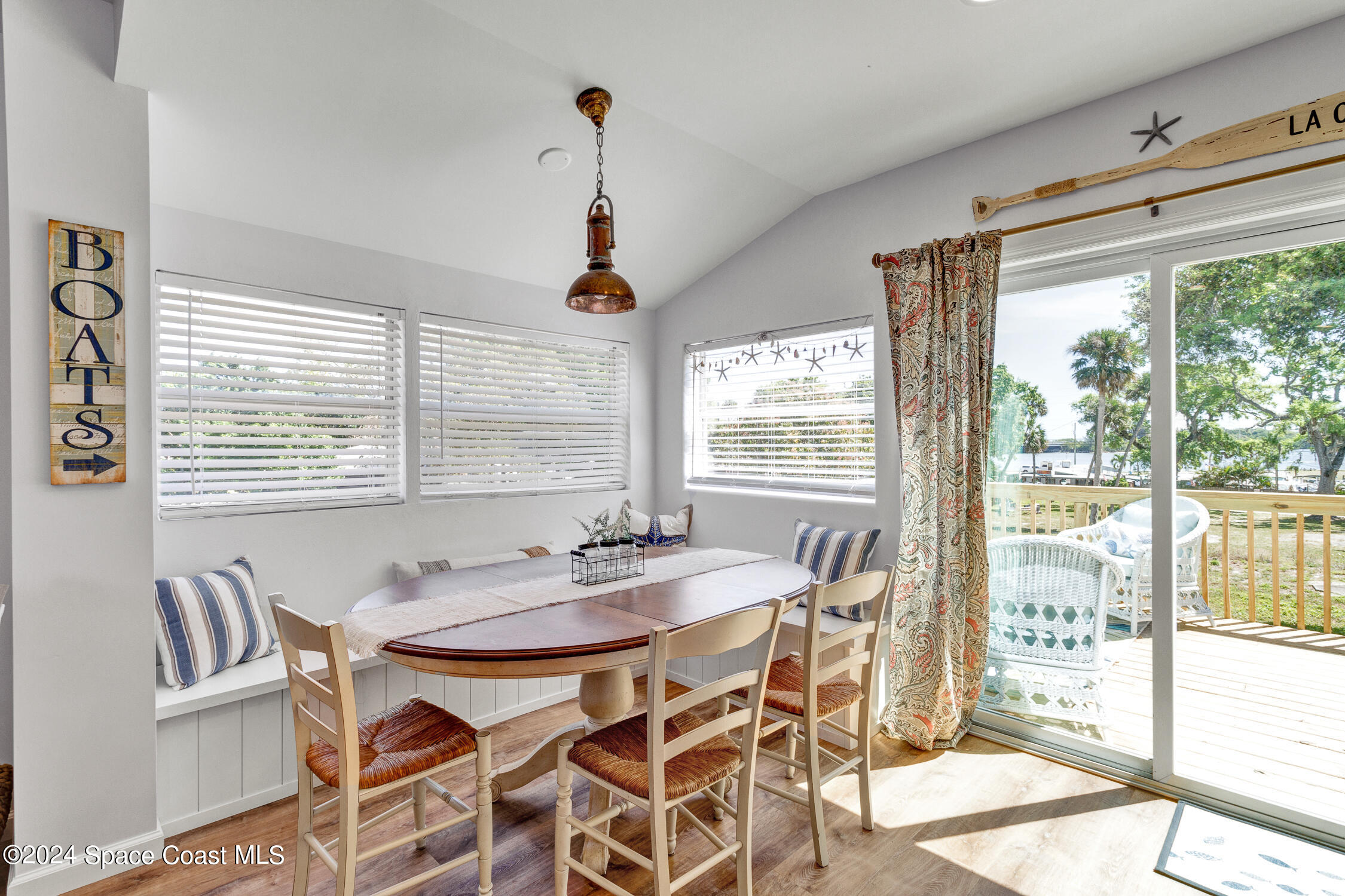 4055 Palm Avenue Micco, FL 32976 - Photo 12 of 58 a dining room with furniture and window