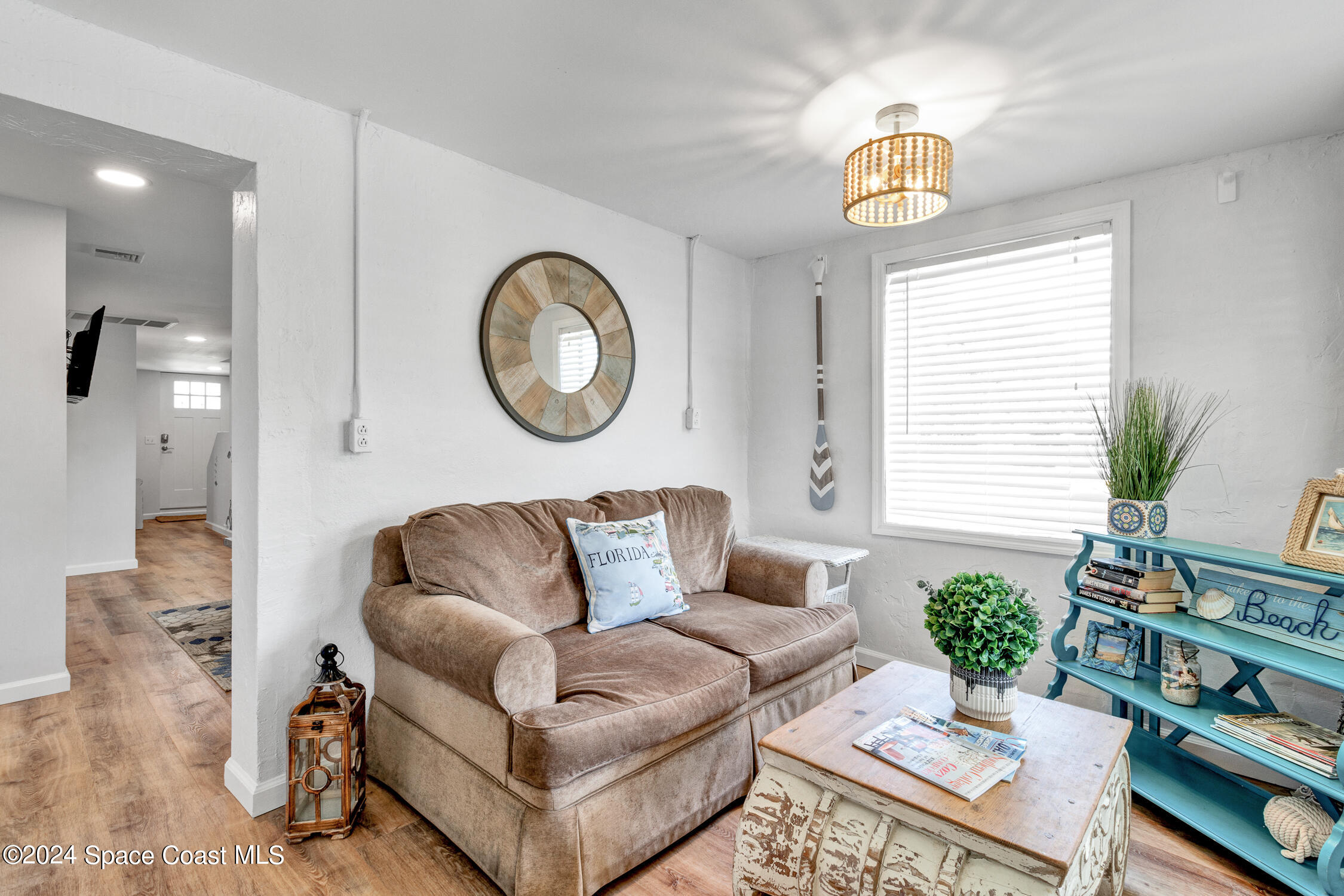 4055 Palm Avenue Micco, FL 32976 - Photo 20 of 58 a living room with furniture and a window