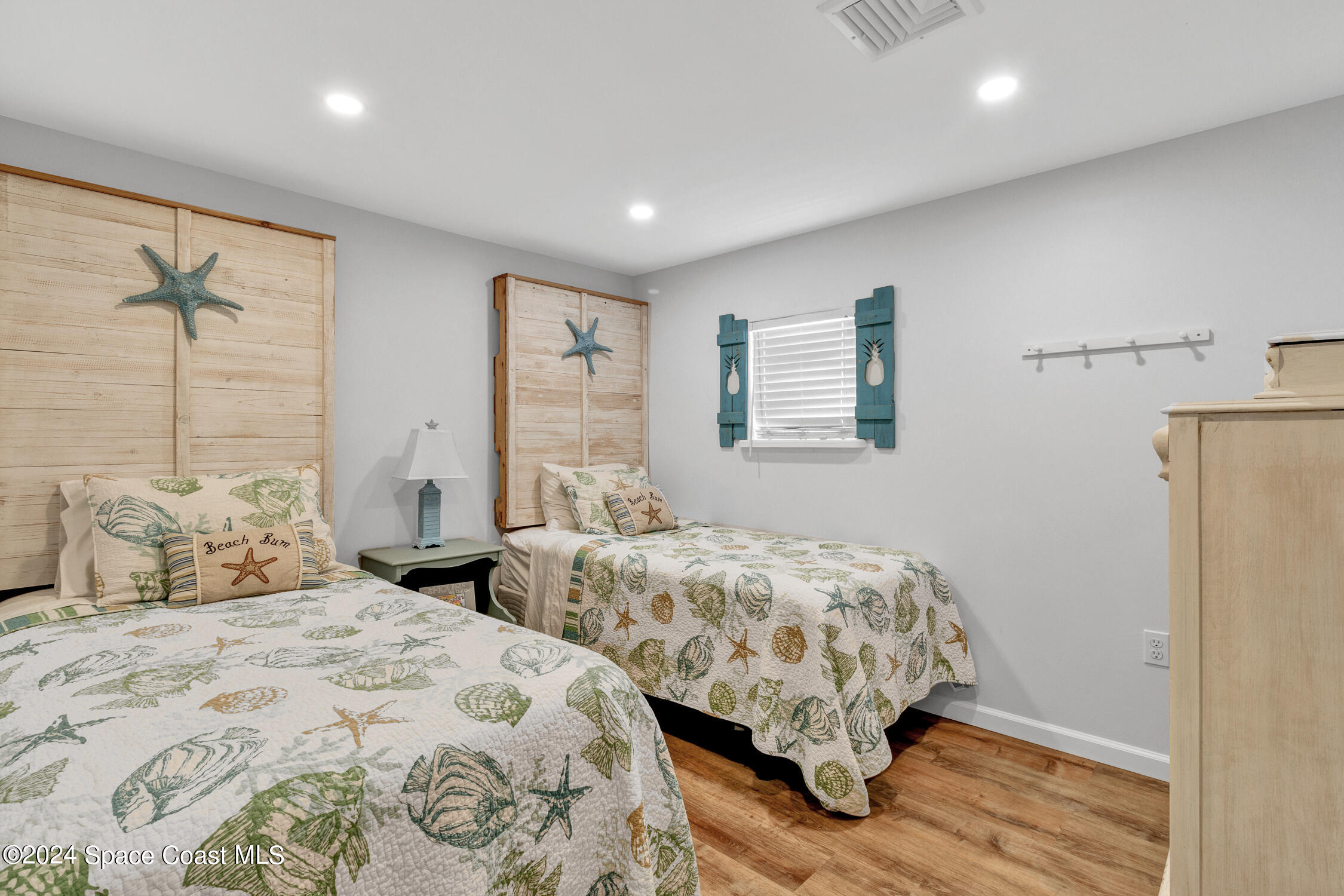 4055 Palm Avenue Micco, FL 32976 - Photo 25 of 58 a bedroom with two beds and a dresser