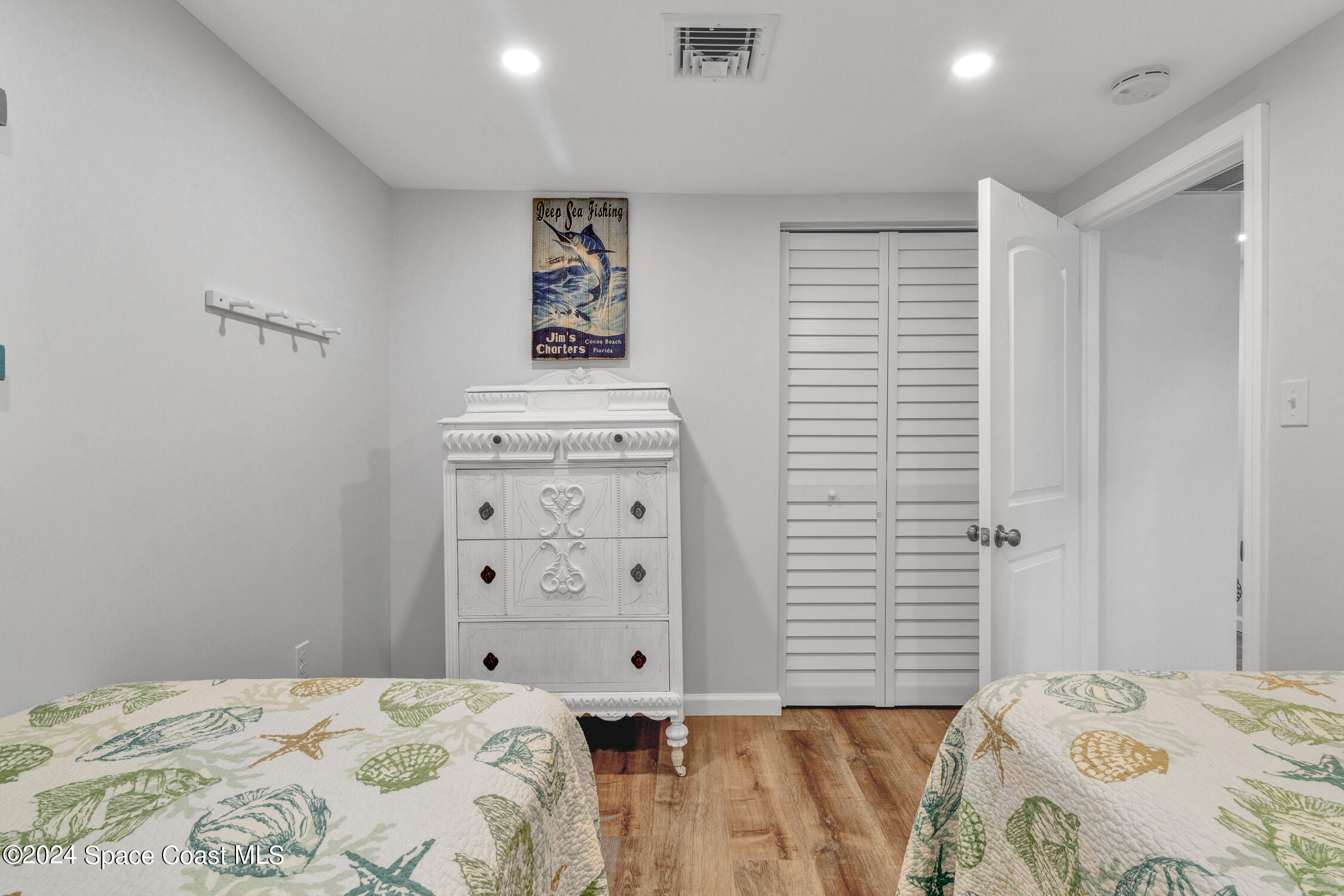 4055 Palm Avenue Micco, FL 32976 - Photo 26 of 58 a bedroom with a bed and a window