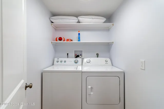 a balcony with wooden floor and outdoor seating