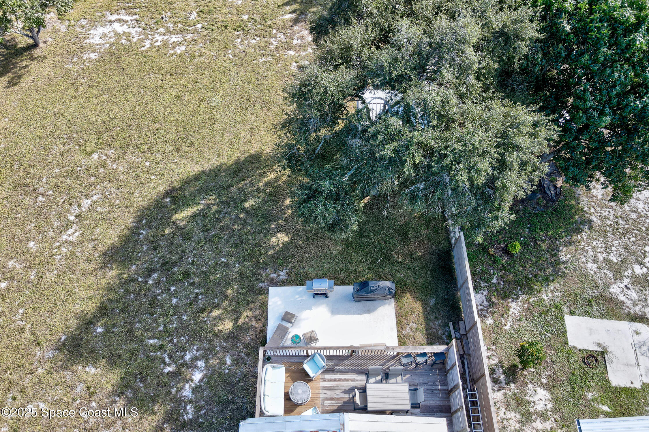 4055 Palm Avenue Micco, FL 32976 - Photo 40 of 58 a view of a house with a yard