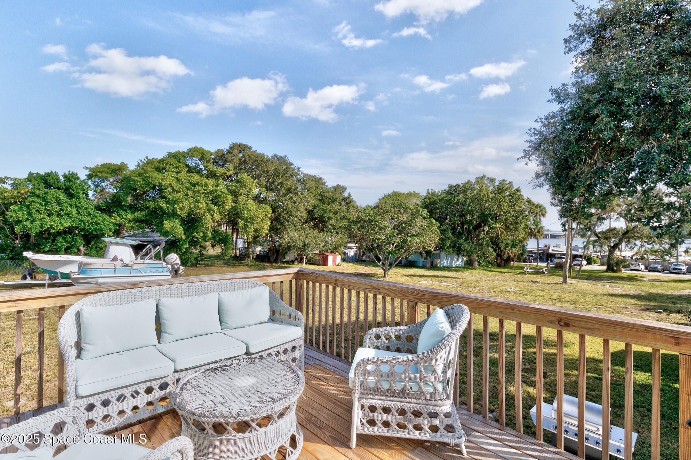 4055 Palm Avenue Micco, FL 32976 - Photo 43 of 58 a view of a roof deck with couches and sky view
